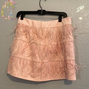 New mini skirt size large . Suede with feathers